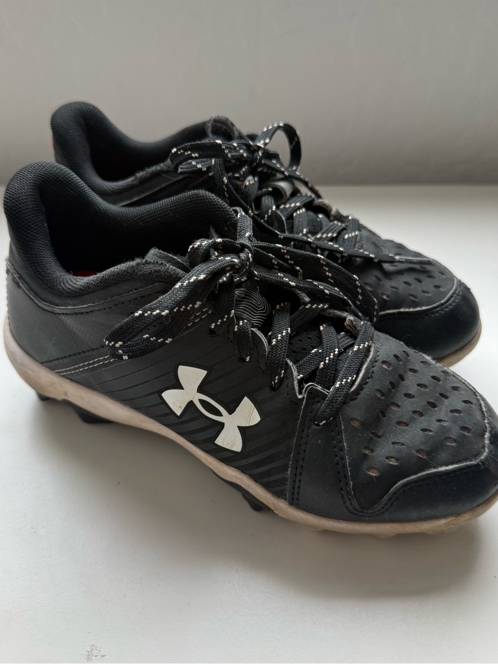 Under Armour Kids Black and White Athletic Cleats